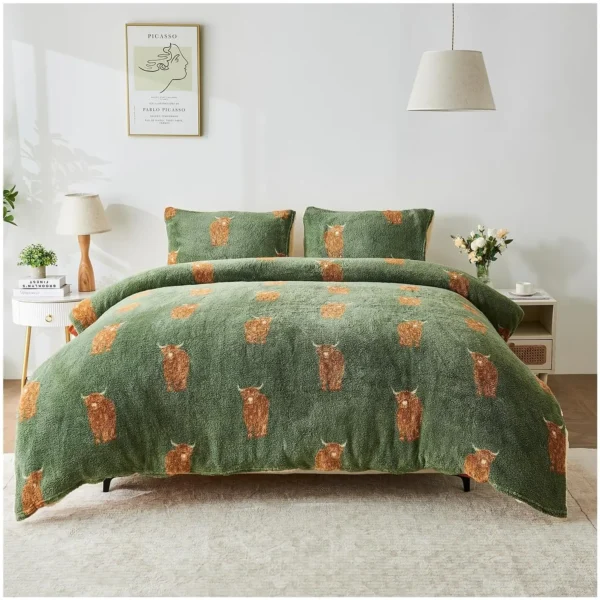 Bed with a green bear-patterned comforter and matching pillows in a bright, minimalist bedroom with white nightstands, lamps, and a Picasso poster on the wall.