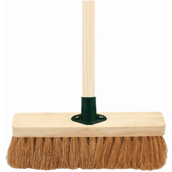 Wooden push broom head with dense brown bristles and a vertical wooden handle attached by a green connector