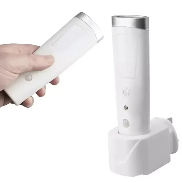 White handheld remote pointed toward a tall white appliance with a silver top and a visible power button.