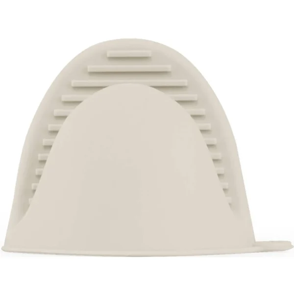 Beige silicone foot scrubber with ridged edge for exfoliation. Accessory shown close-up.