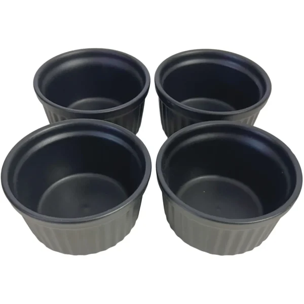 JMF0072 Four black plastic plant pots arranged in a cluster, empty and ready for planting