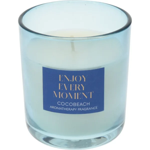 Blue glass candle jar with a label reading 'ENJOY EVERY MOMENT' and 'Coco Beach' aromatherapy fragrance.