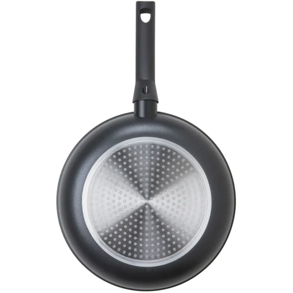 Top-down view of a black frying pan with a long handle and a circular perforated silver cooking surface.
