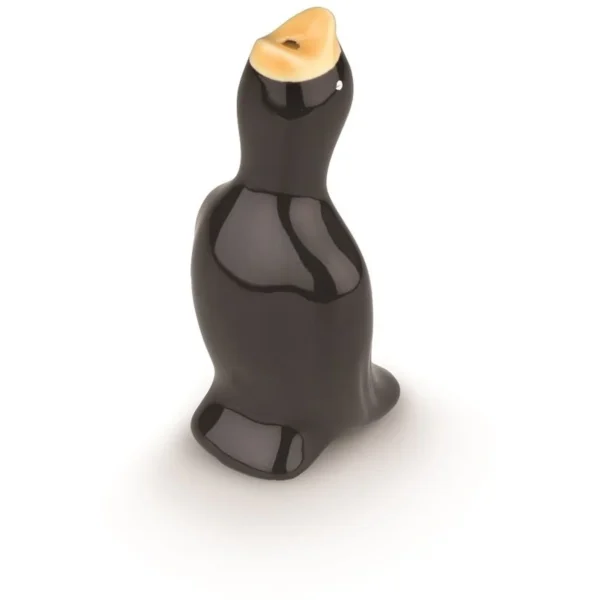Glossy black duck-shaped sculpture with an orange beak on a white surface, viewed from the side.