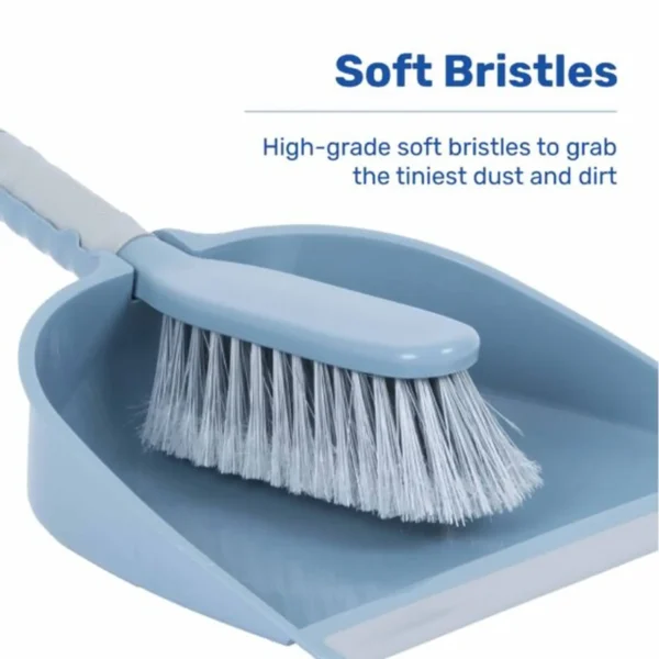 Blue plastic dustpan with a matching brush, part of a cleaning set.