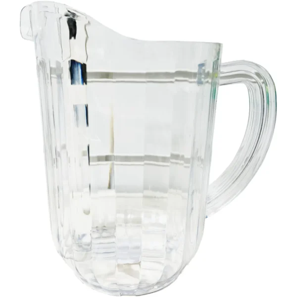 Faceted crystal pitcher with a curved handle, empty.